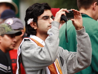 photographer with flower on ear 