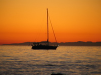 sail boat of flaming sky 