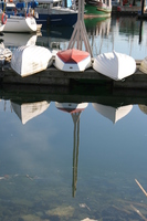 three boats and their reflection 