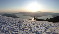 lake below snowy hills 