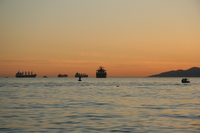 ships across sunset beach 